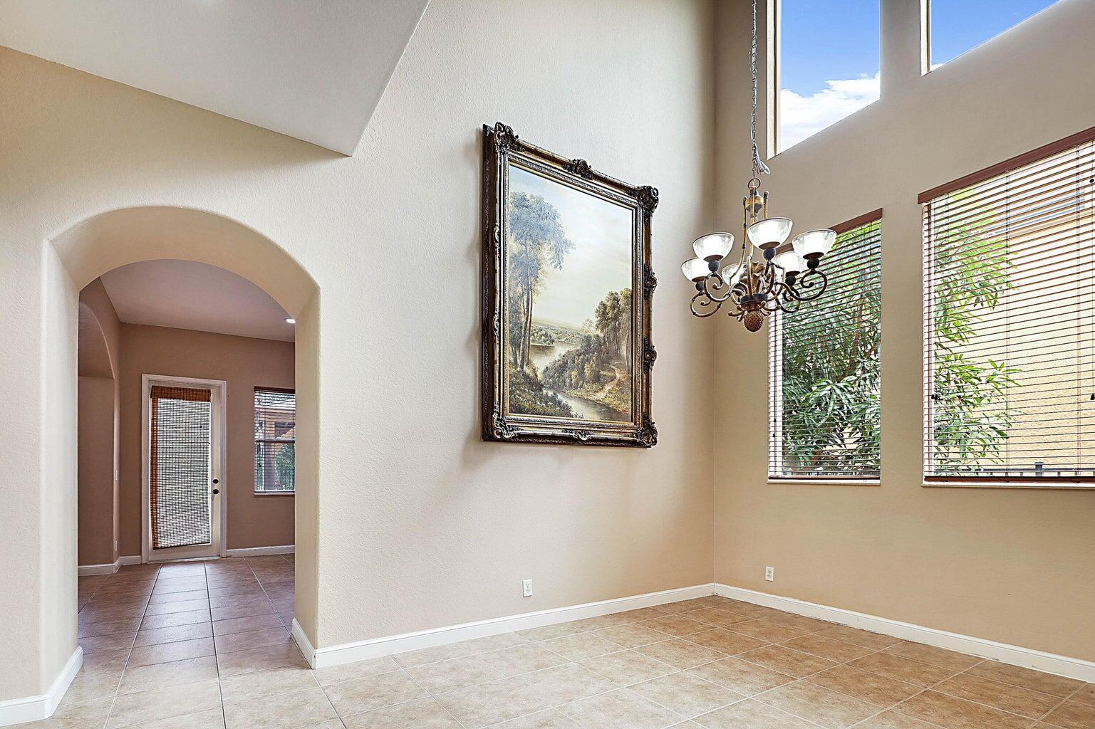 748 Cresta Circle West Palm Beach, FL 33413 - Photo 15 of 62 an empty room with windows and entrance