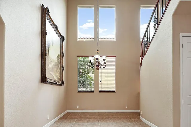 a kitchen with stainless steel appliances granite countertop a refrigerator and cabinets