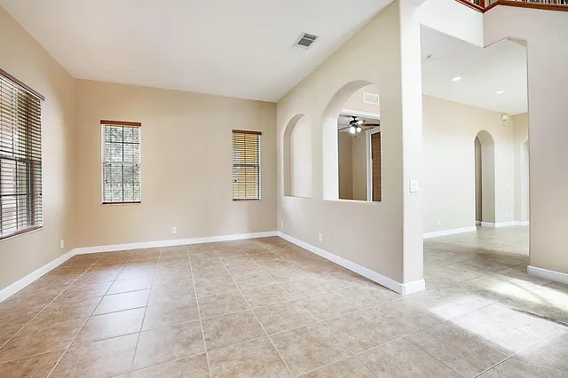 a large kitchen with stainless steel appliances granite countertop a stove sink and cabinets