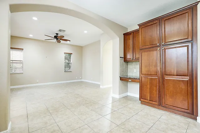 a kitchen with a stove a sink and a microwave