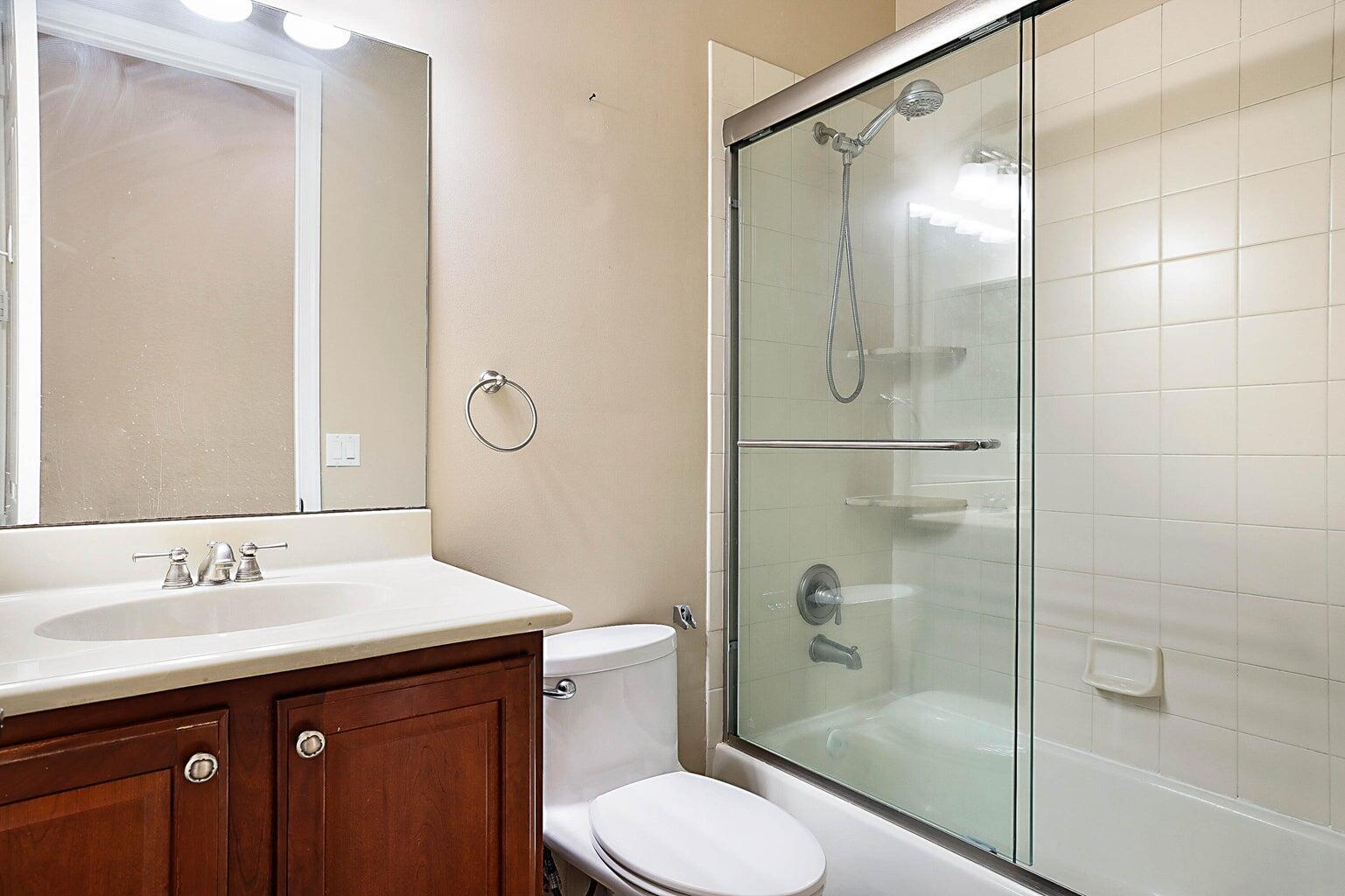 748 Cresta Circle West Palm Beach, FL 33413 - Photo 25 of 62 a bathroom with a sink toilet and shower