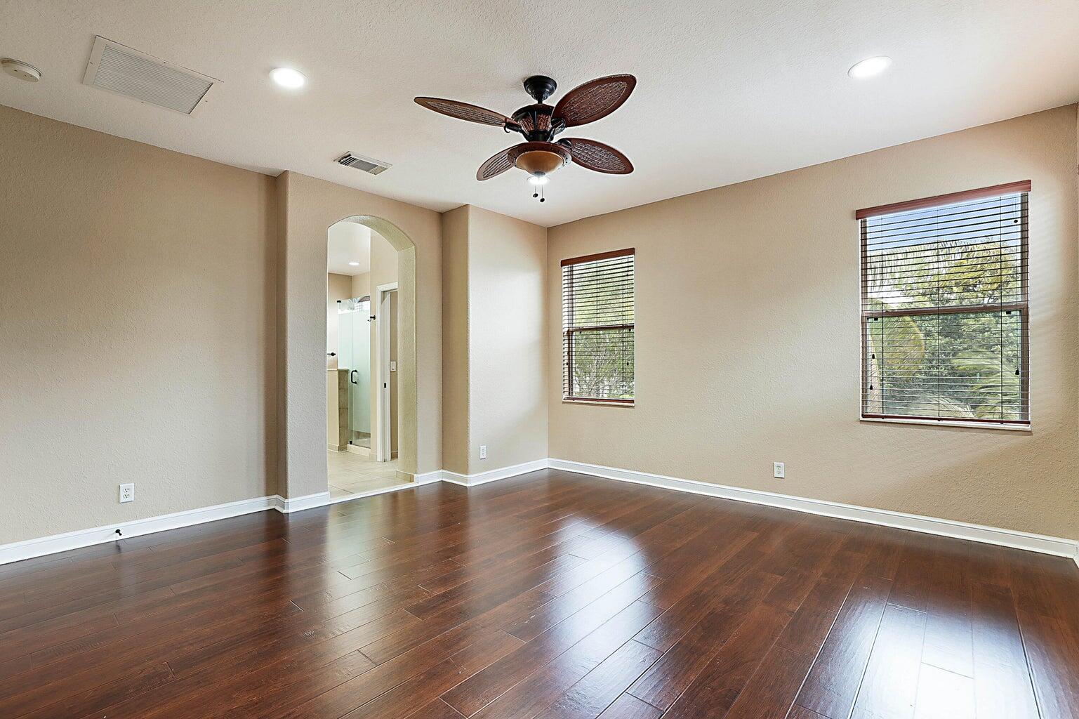 748 Cresta Circle West Palm Beach, FL 33413 - Photo 32 of 62 a view of an empty room with wooden floor and a window
