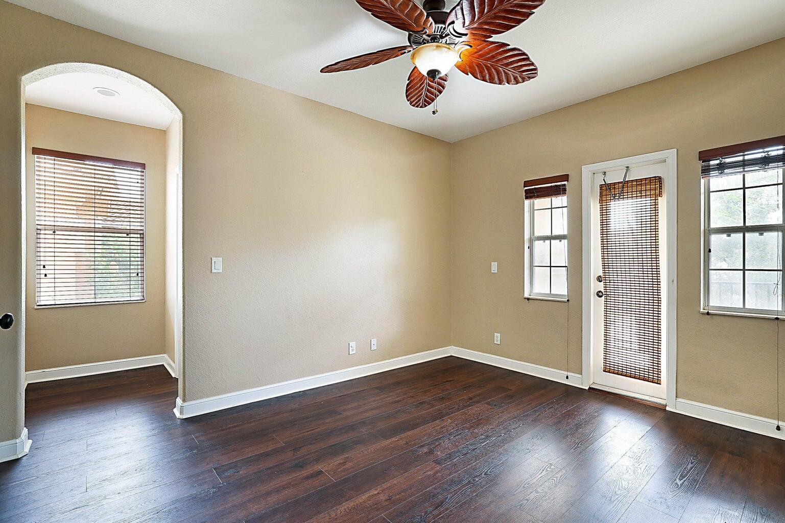 748 Cresta Circle West Palm Beach, FL 33413 - Photo 35 of 62 a view of an empty room with window and wooden floor