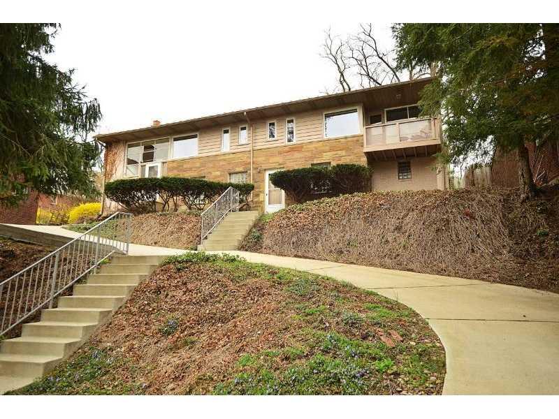 Exterior Front. Privately located above the street with drive way access to Front door and off street parking..