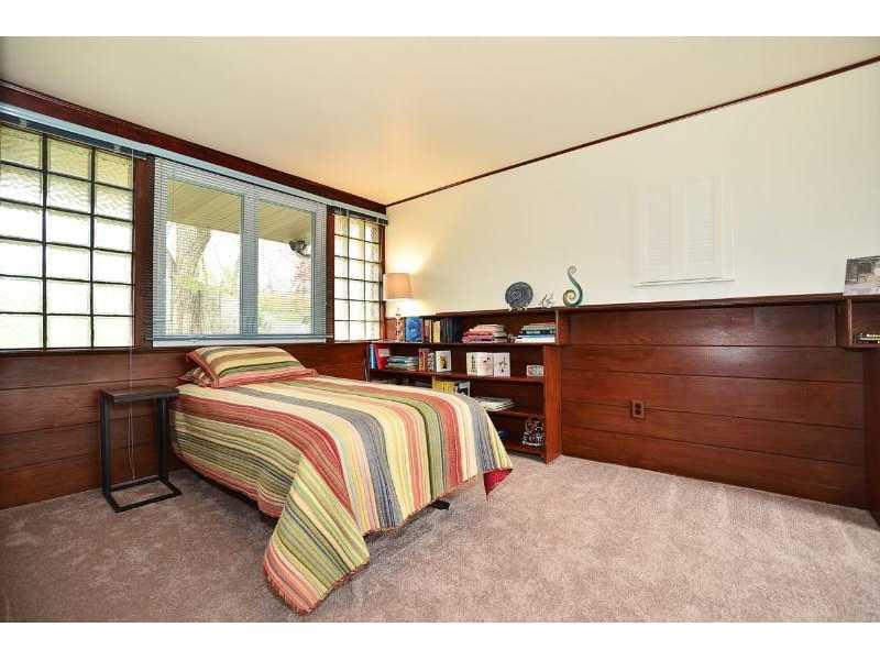 6635 Landview Road Pittsburgh, PA 15217 - Photo 11 of 17 Bedroom. This bedroom features a built in dresser, desk and book shelves.