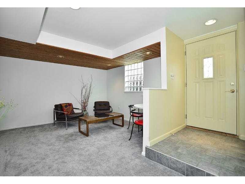 Entry/Foyer. Enter the home on the lower level into an area that is currently being used as a den.