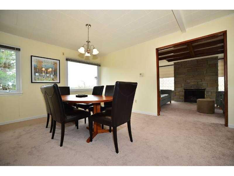 Dining Room. The dining room boast a view of the Waterfront and is only steps away from the kitchen.
