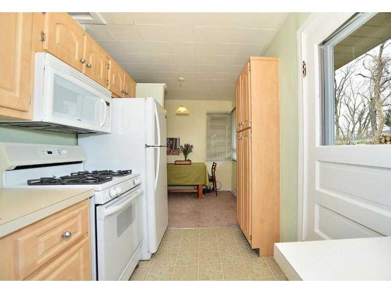 Kitchen. The kitchen offers a large pantry cupboard and has a separate eating area.