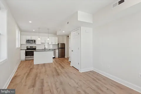 a view of kitchen with wooden floor