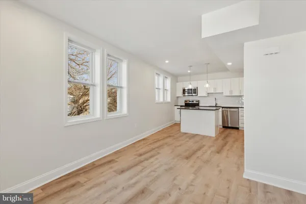 a view of kitchen with wooden floor