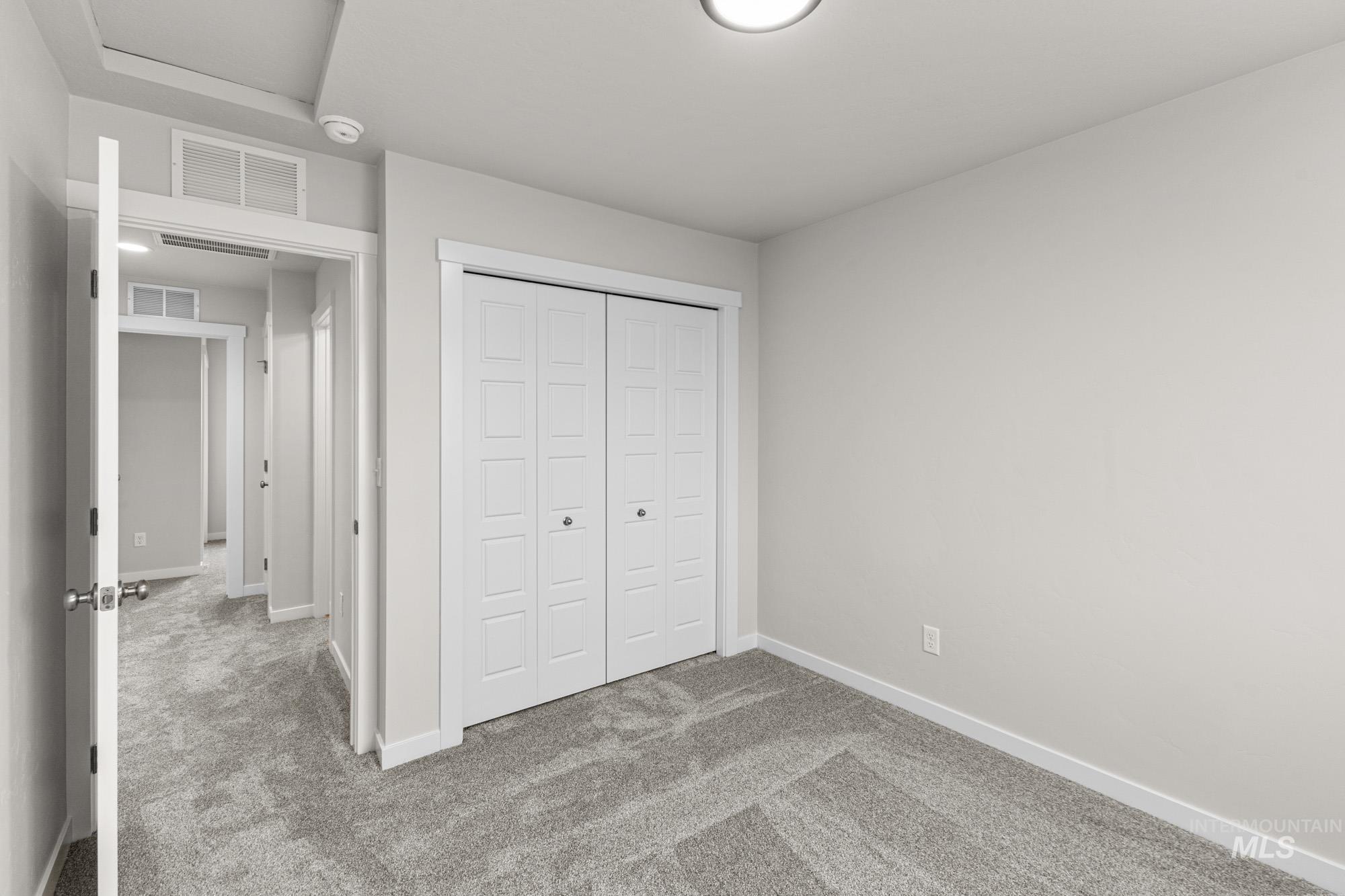 10467 West Tinder Street Star, ID 83669 - Photo 13 of 20 Unfurnished bedroom with carpet and a closet