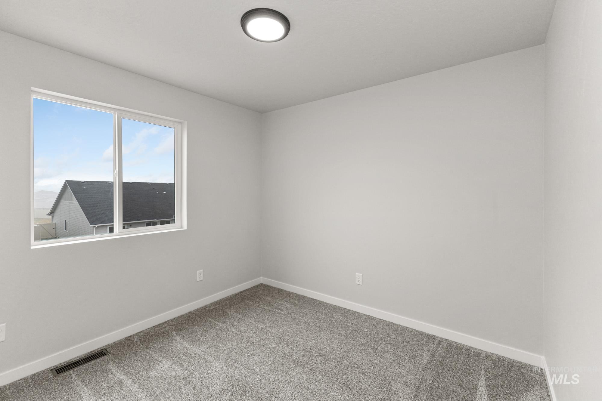10467 West Tinder Street Star, ID 83669 - Photo 14 of 20 Carpeted spare room with baseboards
