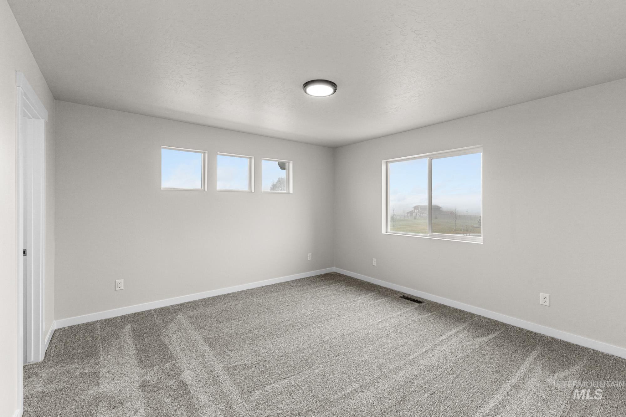 10467 West Tinder Street Star, ID 83669 - Photo 17 of 20 Unfurnished room featuring light colored carpet and baseboards