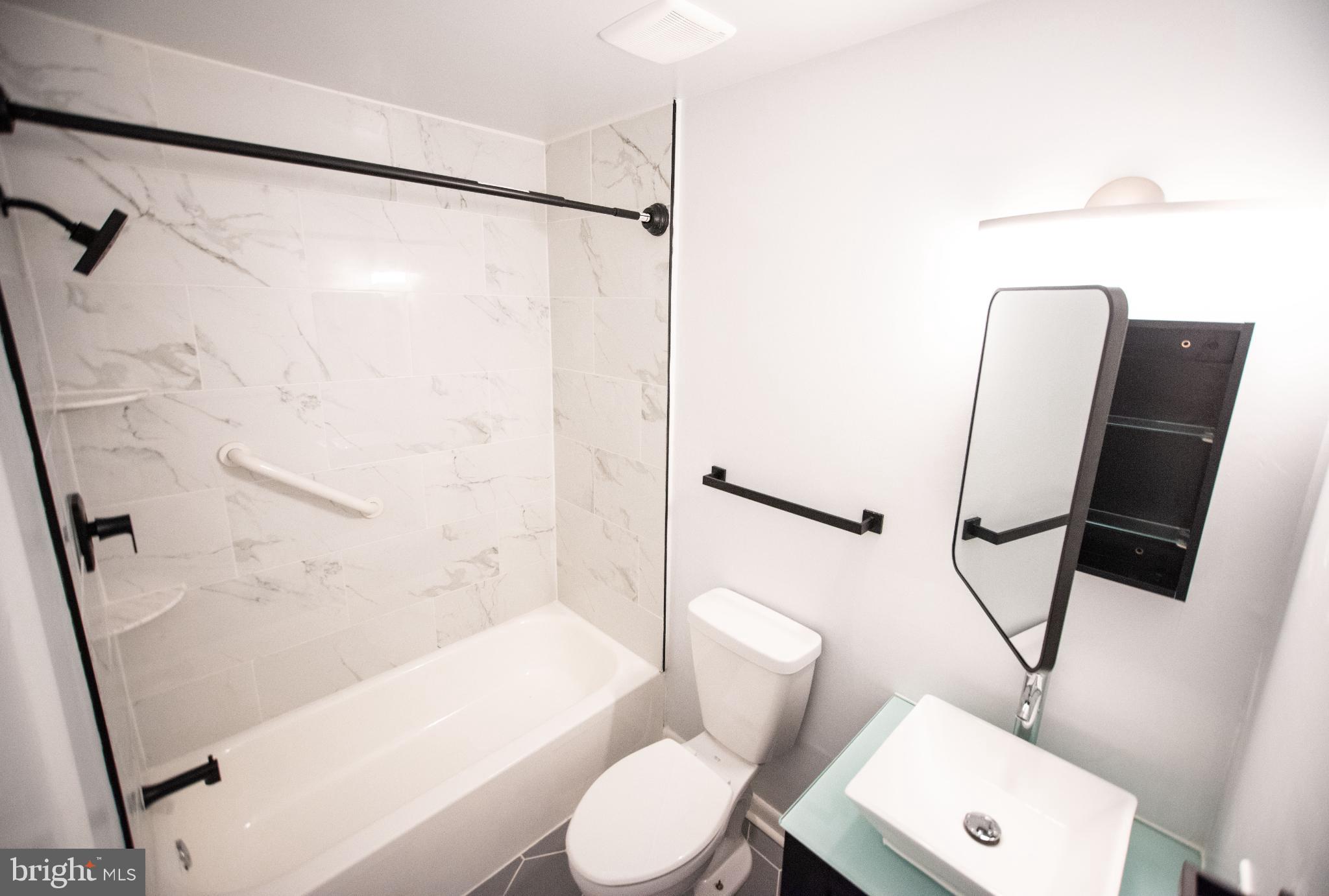 13408 Shady Knoll Drive, Unit 308 Silver Spring, MD 20904 - Photo 12 of 21 Sleek modern bathroom with elegant finishes.