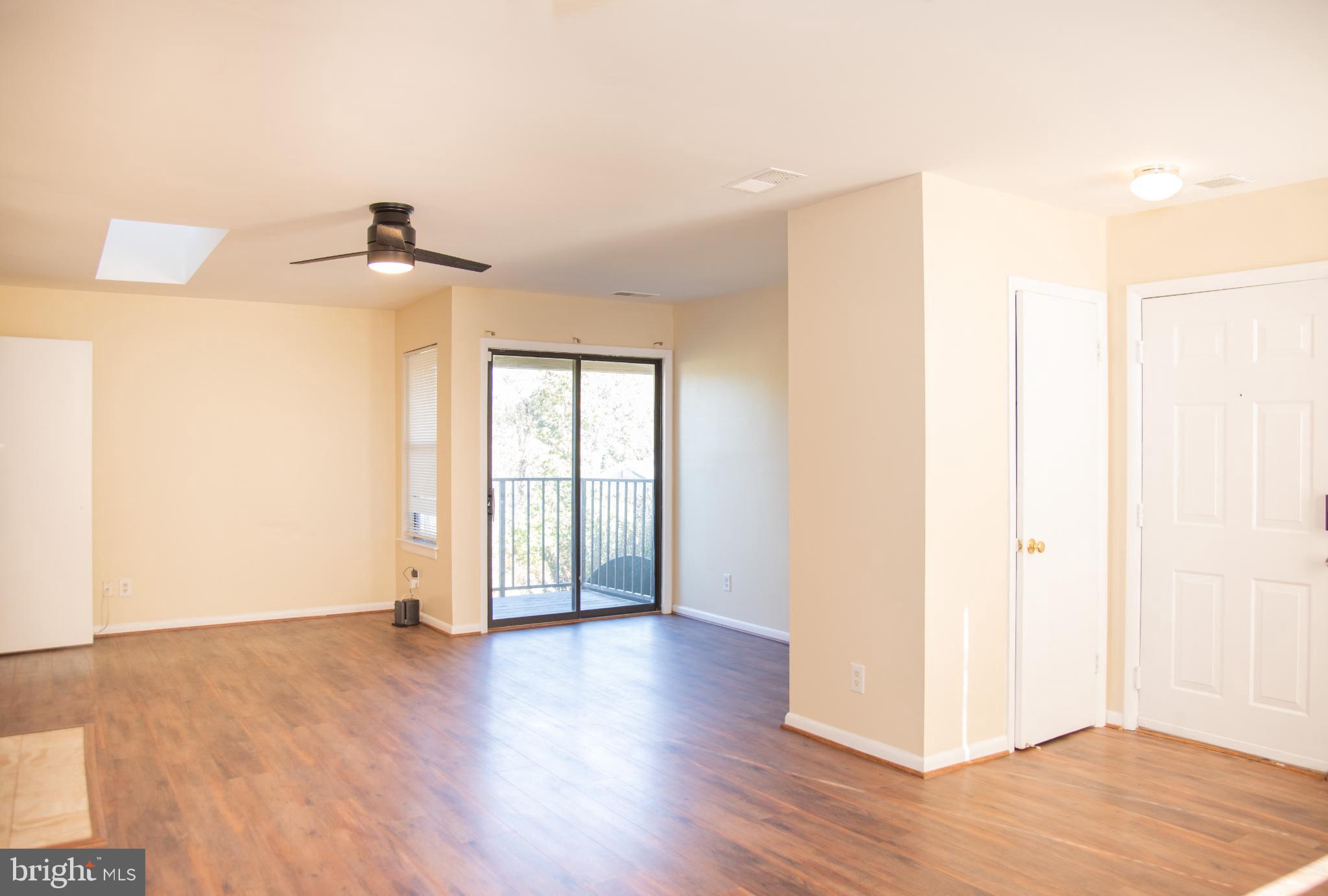 13408 Shady Knoll Drive, Unit 308 Silver Spring, MD 20904 - Photo 2 of 21 Bright and airy living space with balcony access.