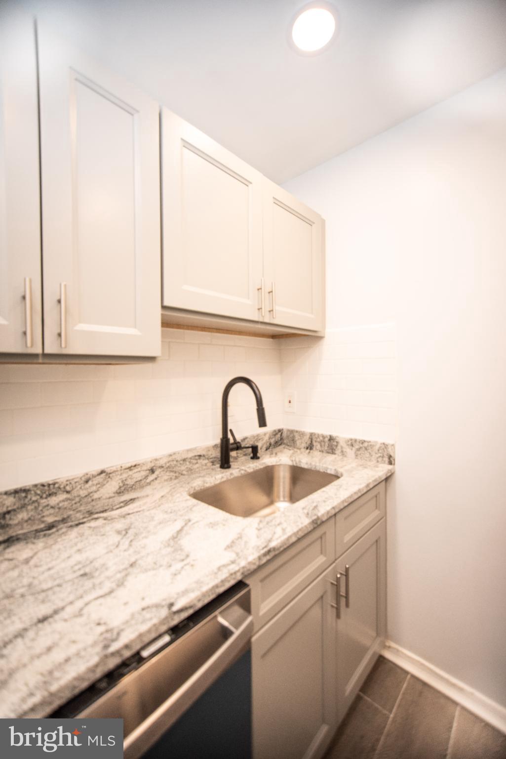 13408 Shady Knoll Drive, Unit 308 Silver Spring, MD 20904 - Photo 7 of 21 Sleek kitchen with modern finishes.