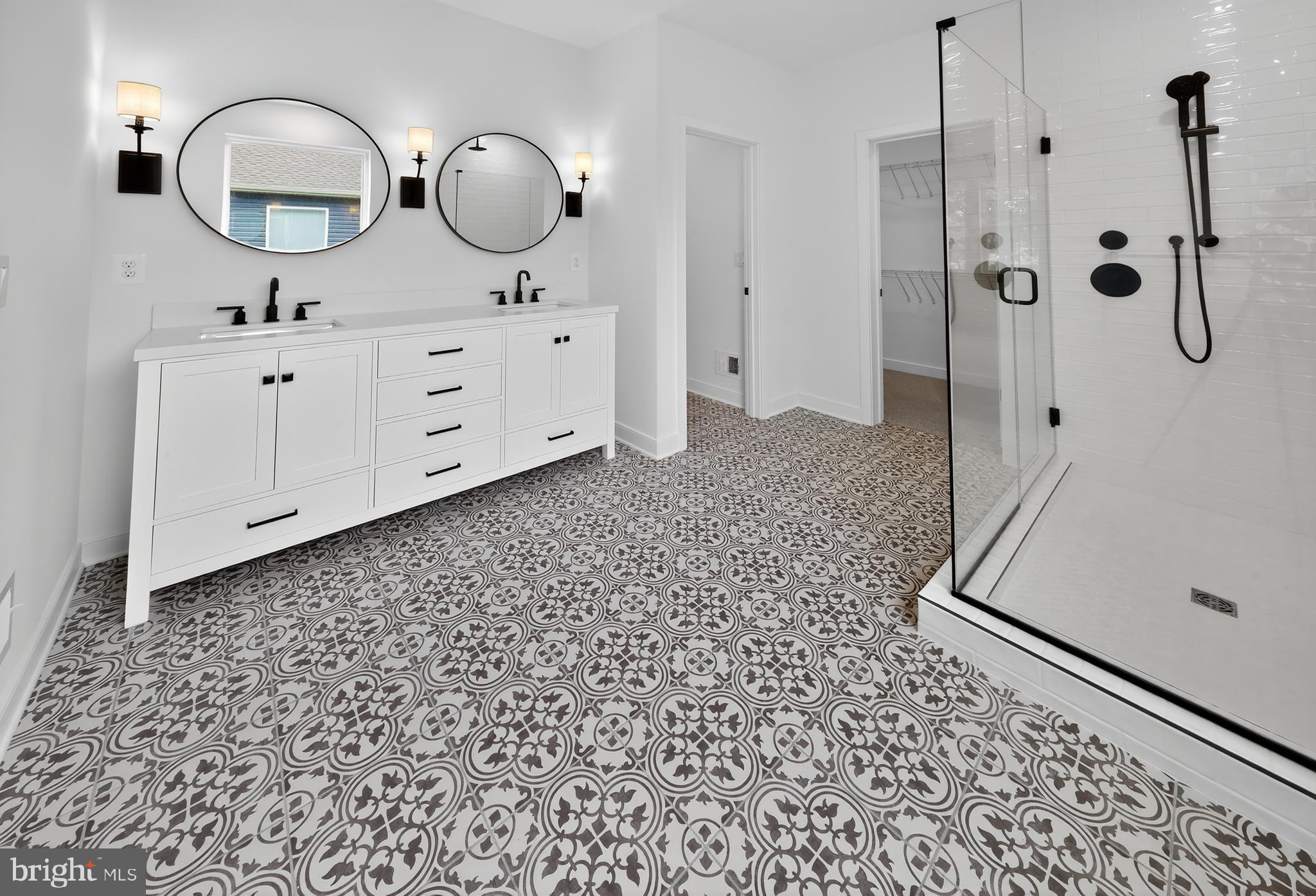36444 Maple Ridge Lane Georgetown, DE 19947 - Photo 13 of 29 a bathroom with a double vanity sink toilet and mirror
