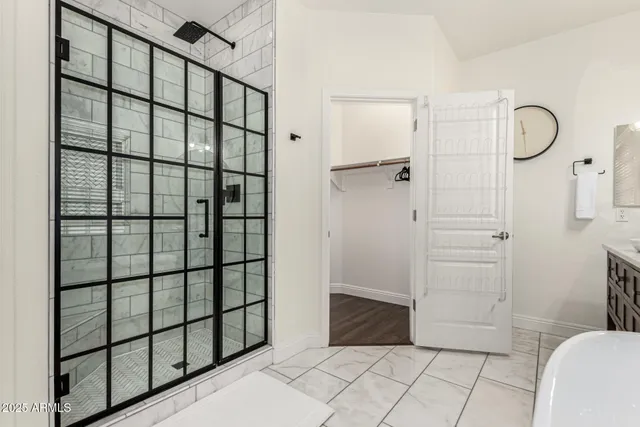 a view of a patio with a table and chairs