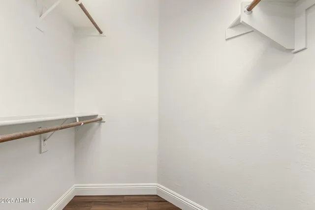 a view of a patio with a dining table and chairs
