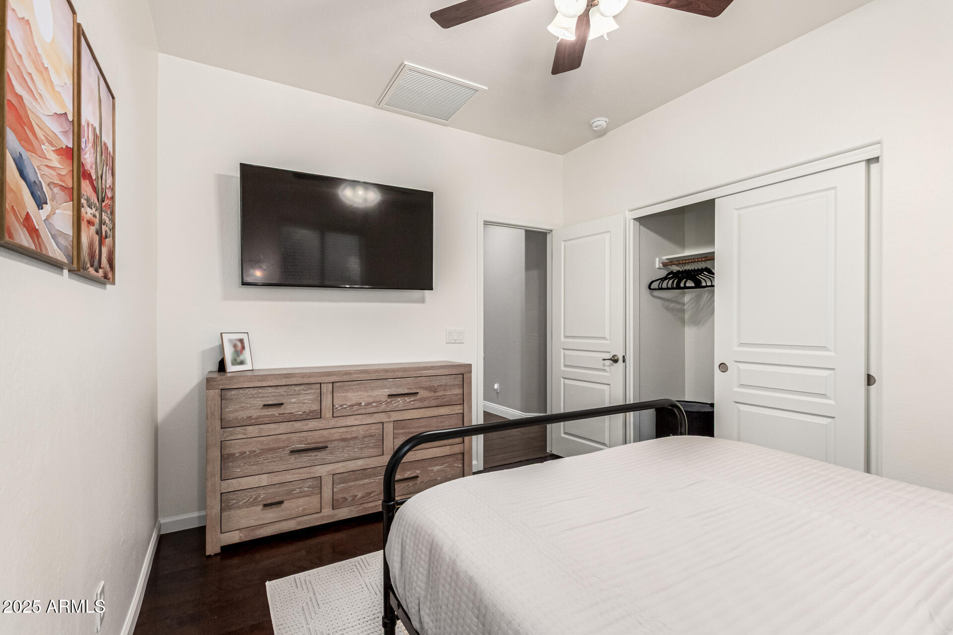 11411 East Sebring Circle Mesa, AZ 85212 - Photo 25 of 87 a bedroom with a bed and a flat screen tv