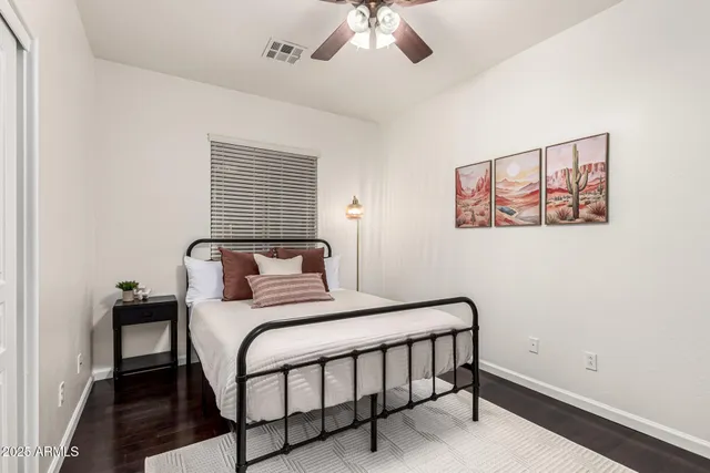 a kitchen with stainless steel appliances a table and chairs in it