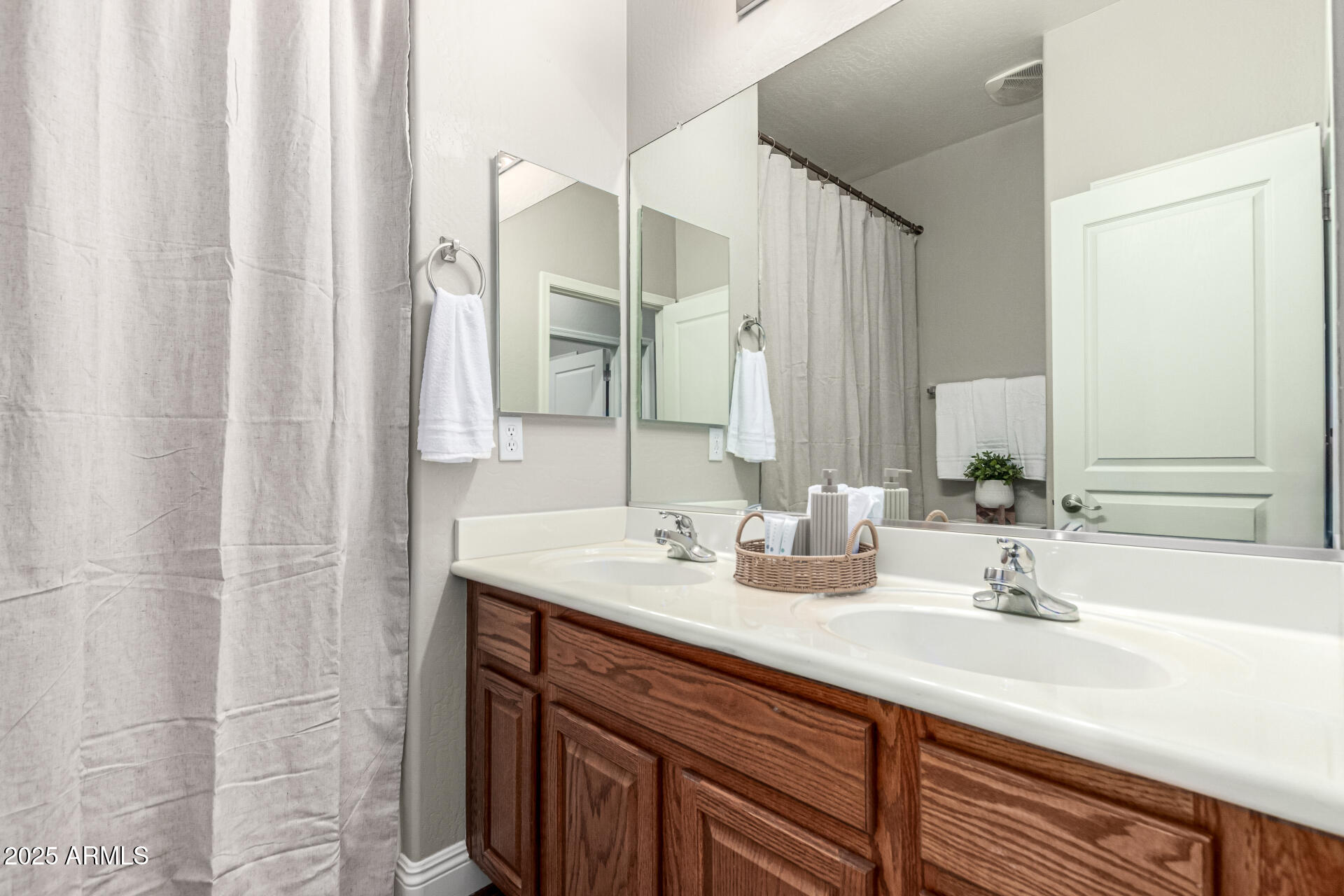 11411 East Sebring Circle Mesa, AZ 85212 - Photo 29 of 87 a bathroom with a double vanity sink and a mirror