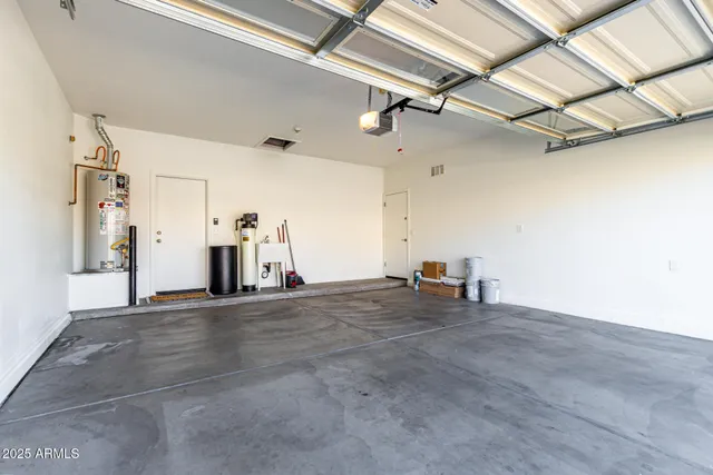a kitchen with sink and white cabinets