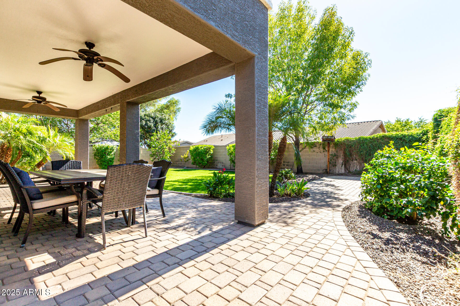 11411 East Sebring Circle Mesa, AZ 85212 - Photo 35 of 87 a view of a patio with a dining table and chairs