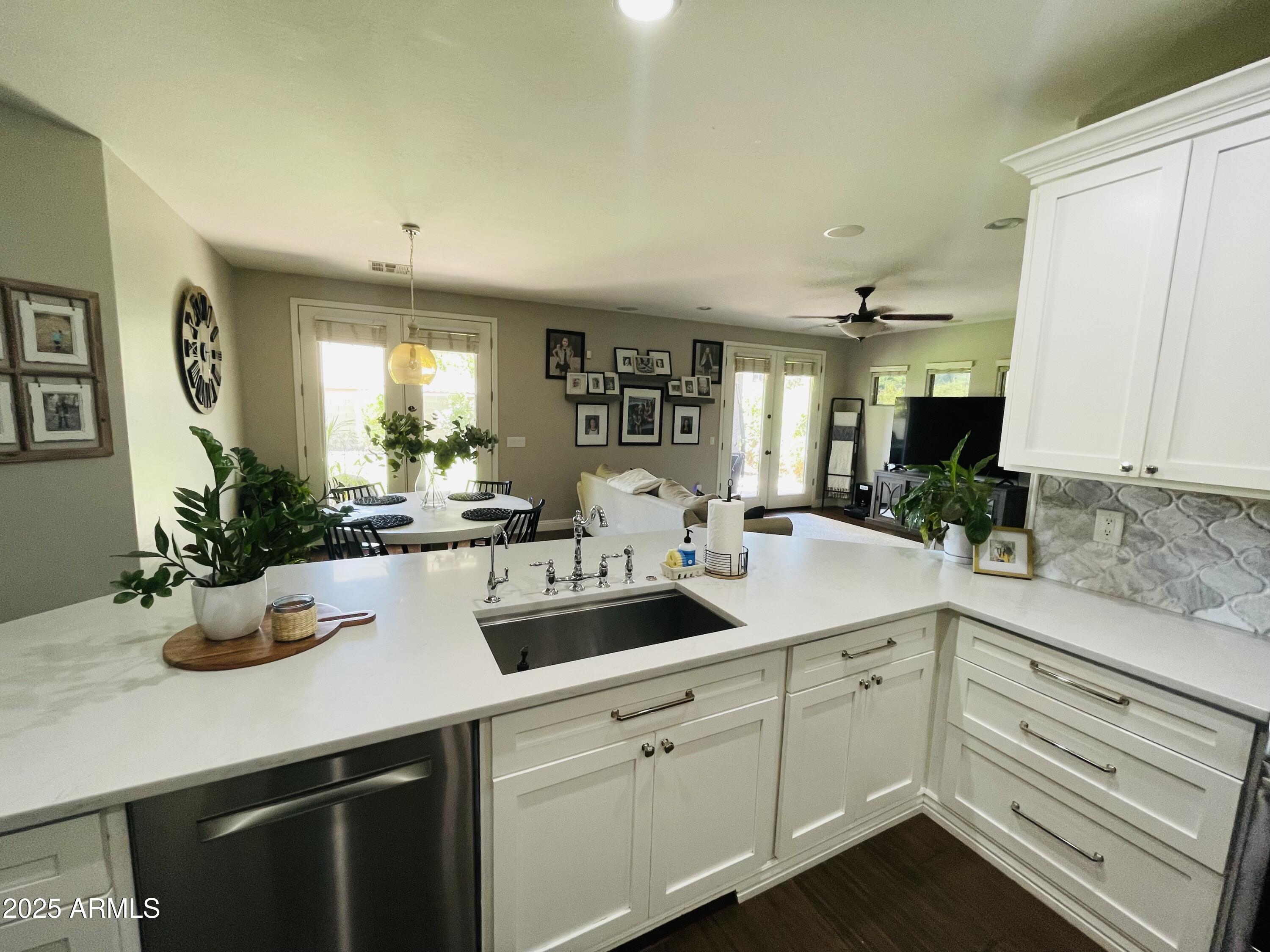 11411 East Sebring Circle Mesa, AZ 85212 - Photo 54 of 87 a kitchen with sink and white cabinets