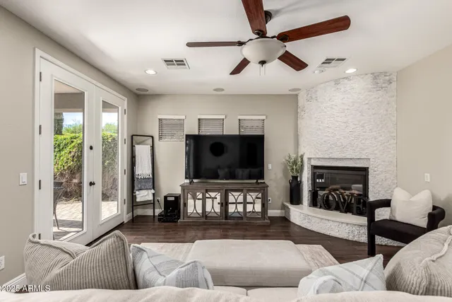 a dining room with furniture and wooden floor