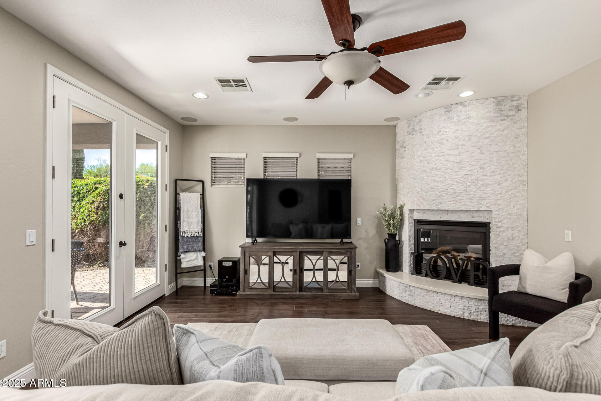 11411 East Sebring Circle Mesa, AZ 85212 - Photo 10 of 87 a living room with furniture and a flat screen tv