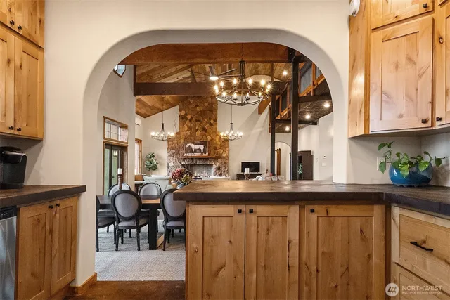 a kitchen with a sink a microwave and cabinets