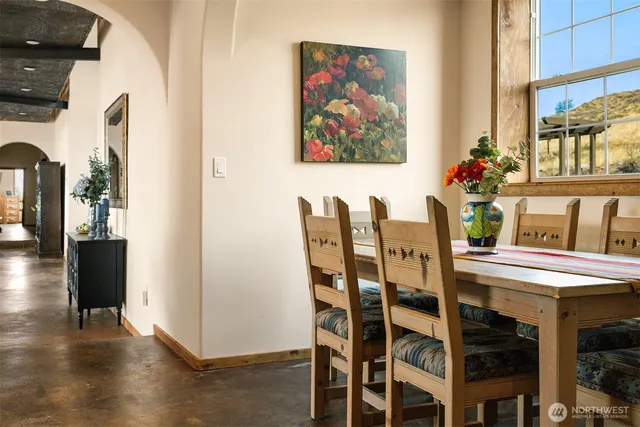 a view of a dining room with furniture wooden floor and a chandelier