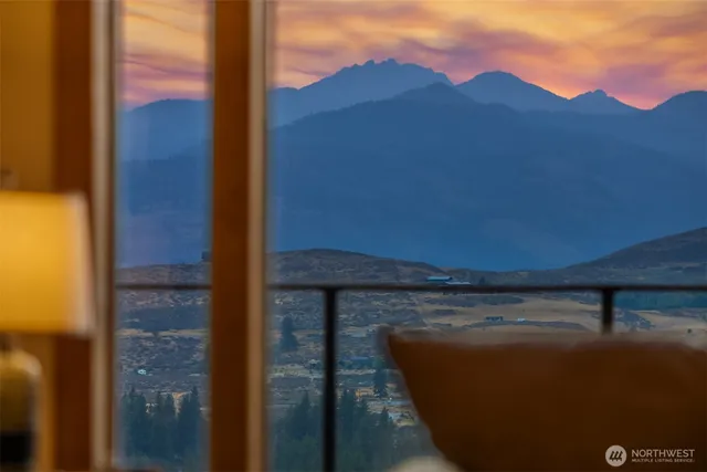 a view of balcony with furniture and a potted plant