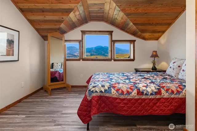 a bathroom with a tub a sink and mirror