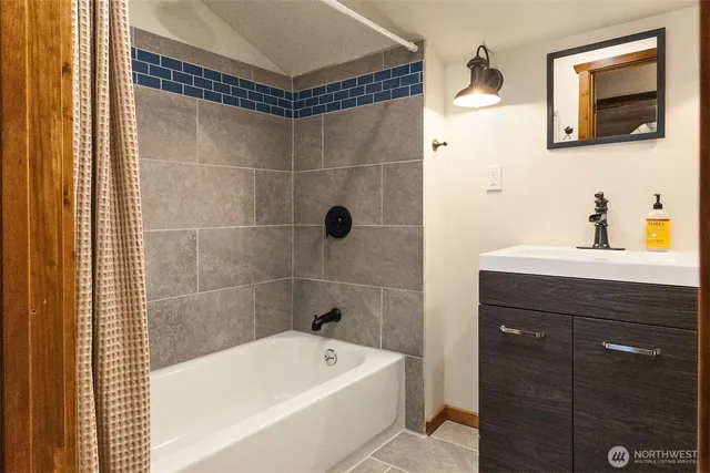 a bed sitting in a bedroom next to a balcony