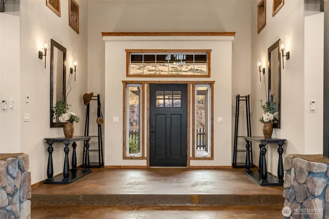 a view of an entryway of house and livingroom