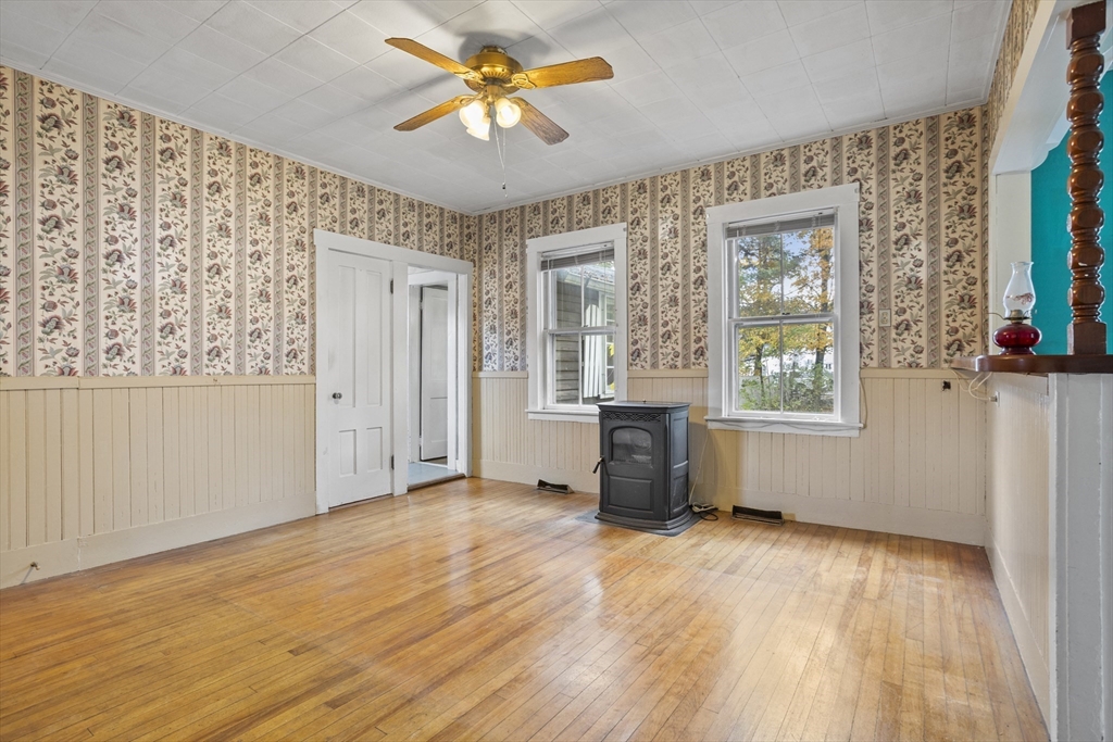 2 Maple Street Shirley, MA 01464 - Photo 11 of 35 a view of an empty room with a window and wooden floor