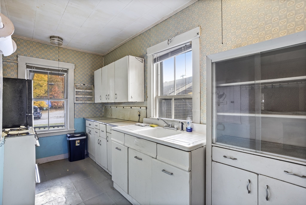 2 Maple Street Shirley, MA 01464 - Photo 15 of 35 a room with a sink window and cabinets