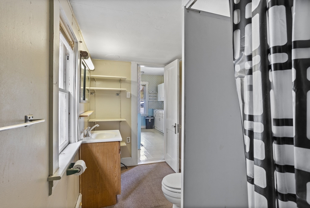 2 Maple Street Shirley, MA 01464 - Photo 20 of 35 a bathroom with a granite countertop sink
