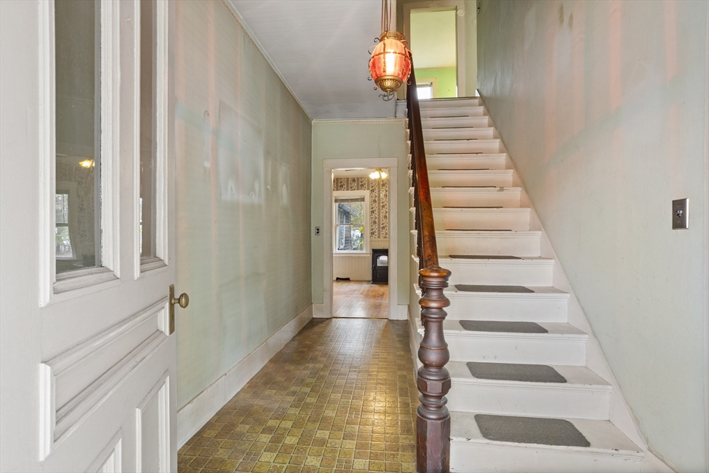 2 Maple Street Shirley, MA 01464 - Photo 2 of 35 a view of a hallway with front door wooden floor and windows