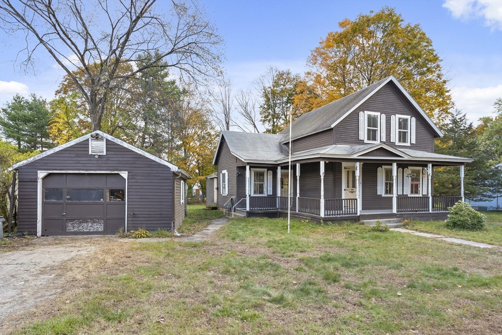 2 Maple Street Shirley, MA 01464 - Photo 27 of 35 front view of a house with a yard
