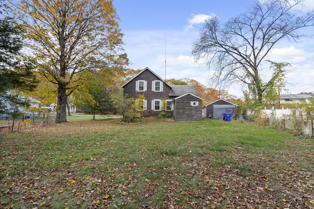 2 Maple Street Shirley, MA 01464 - Photo 30 of 35 a view of a large garden with plants and large trees