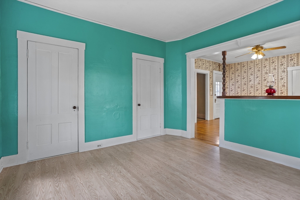 2 Maple Street Shirley, MA 01464 - Photo 4 of 35 a view of an empty room with window and stairs