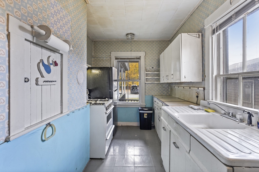2 Maple Street Shirley, MA 01464 - Photo 6 of 35 a kitchen with a sink stove and refrigerator