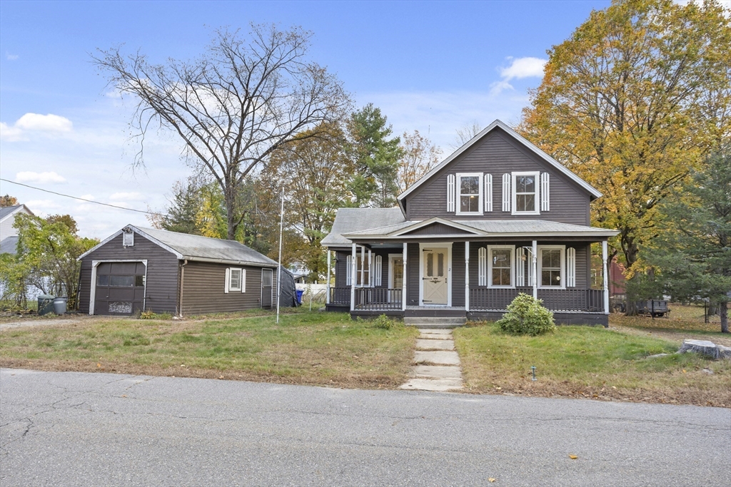 2 Maple Street Shirley, MA 01464 - Photo 8 of 35 front view of a house with a yard