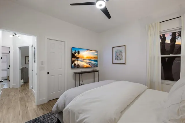 a swimming pool with outdoor seating and yard in the back