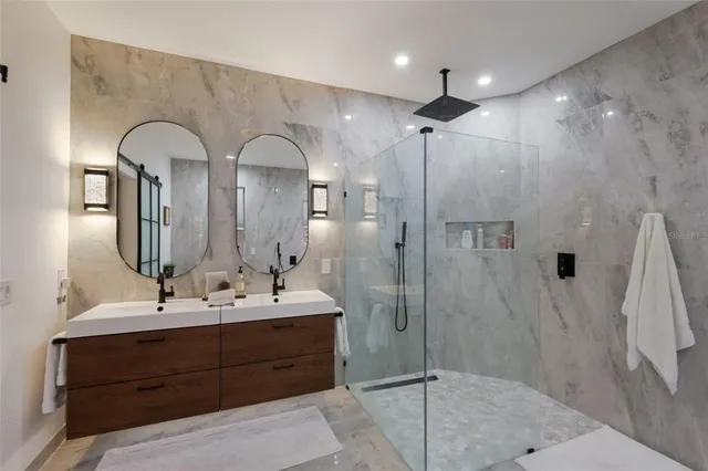 an aerial view of residential houses with city view