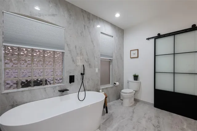 an aerial view of residential houses with city view and lake view