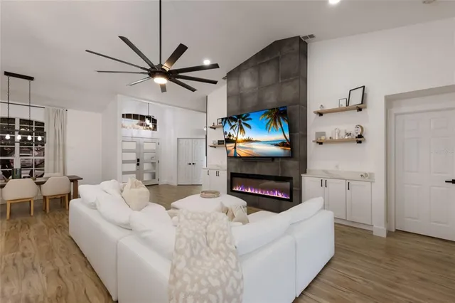 a kitchen with stainless steel appliances a stove microwave and cabinets